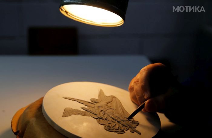 Nelson Carneiro, craftsman from the Casa da Moeda do Brasil (Brazilian Mint) works on the Rio 2016 Olympic medal mold in Rio de Janeiro