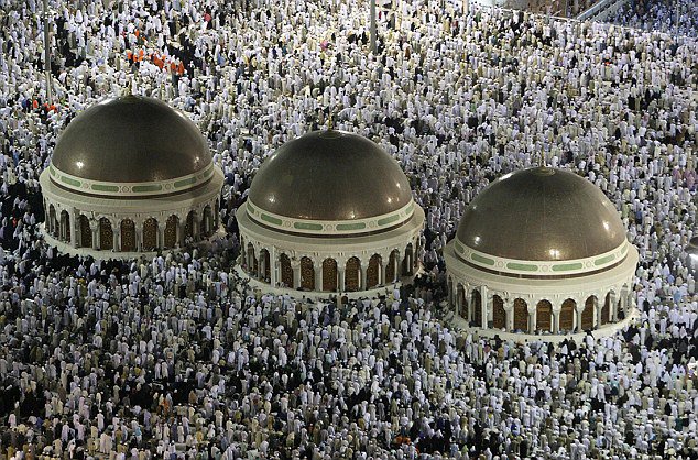 Muslims circle the Kaaba inside the Grand Mosque during night prayer in Mecca